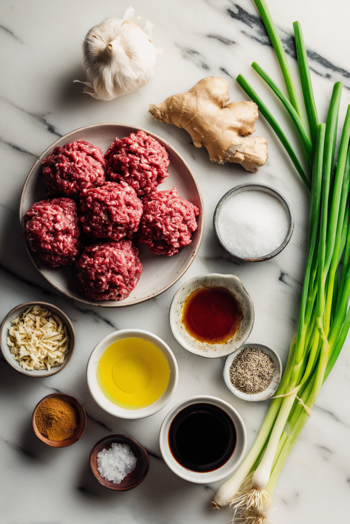 Best Korean BBQ Meatballs 2 Raw ingredients for Korean BBQ Meatballs neatly arranged on a bright marble surface.