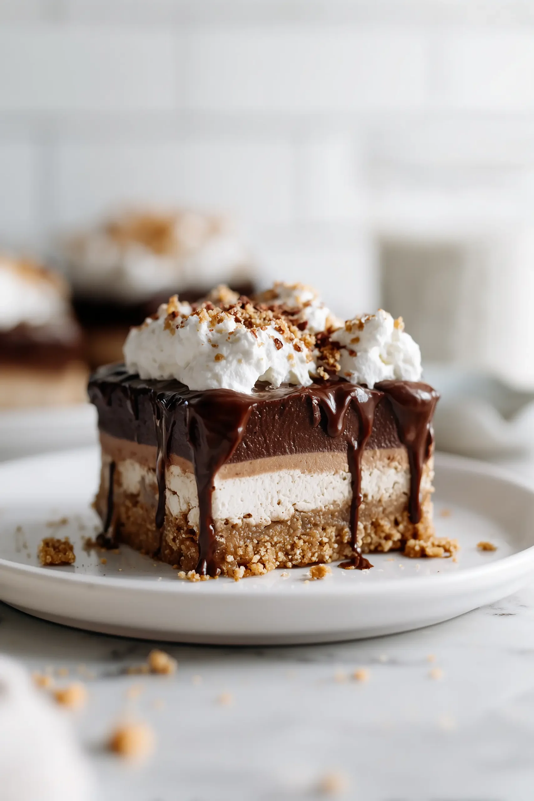 A generous slice of Italian Love Cake on a white plate, showing visible chocolate, ricotta, and pudding layers.
