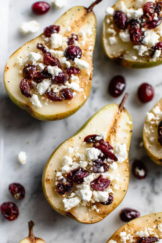 Feta and cranberries scattered over golden roasted pears for Baked Pears Feta Honey Cranberries.